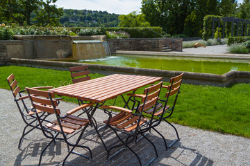 wooden table and chairs in  park