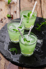 Green cocktail witn rum and mint