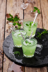 Green cocktail witn rum and mint