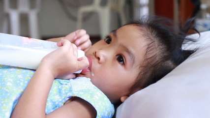 Camera with dolly shoot of Asian baby drink milk