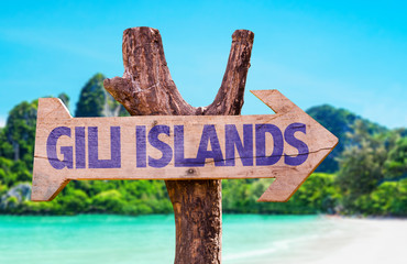 Gili Islands wooden sign with beach background