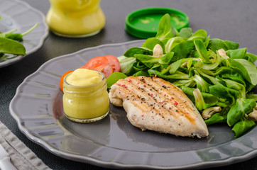 Grilled chicken with salad and nuts