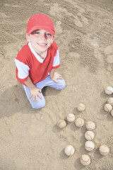 A nice child happy to play baseball