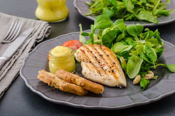 Grilled chicken with salad and nuts