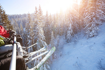 family sitting in ski lift