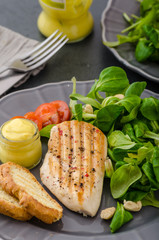Grilled chicken with salad and nuts