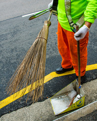 Unidentified street sweeper uses a traditional broom