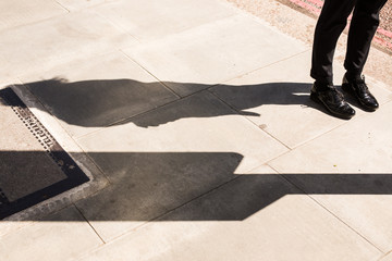Woman legs wearing London style black leather brogues