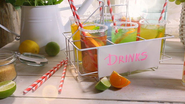 Fresh lemonade with fruit in sunny kitchen