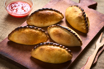 Traditional Bolivian savory meat pastries called Saltena