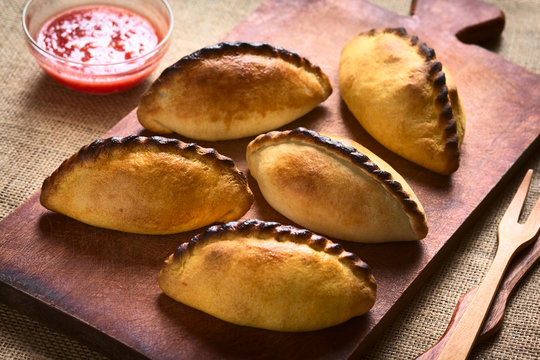 Traditional Bolivian savory meat pastries called Saltena