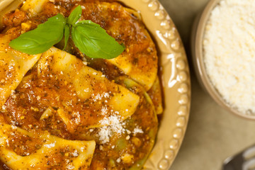 Ravioli with tomato sauce and parmesan cheese. Selective focus.