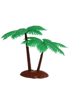Plastic palm tree toy isolated on white background