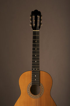 Studio detail photograph of an acoustic spanish classical guitar