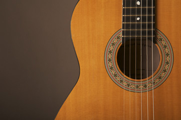 Naklejka premium Studio detail photograph of an acoustic spanish classical guitar