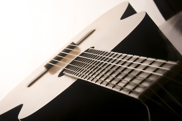 Studio detail photograph of an acoustic spanish classical guitar
