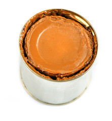 Can of boiled condensed milk isolated on white