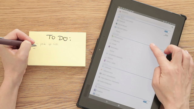 Woman planning "To do" list with digital tablet