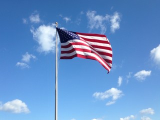 American flag against blue sky
