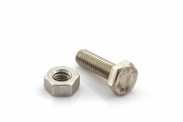 Metal screw and nuts on white background.