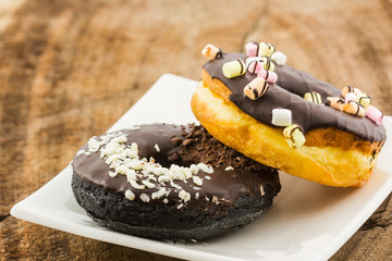 Chocolate donut with Sprinkles.