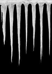Ice icicles on a black background