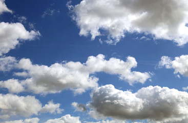 bright clouds in the blue sky in spring