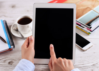 Digital tablet computer with isolated screen in female hands