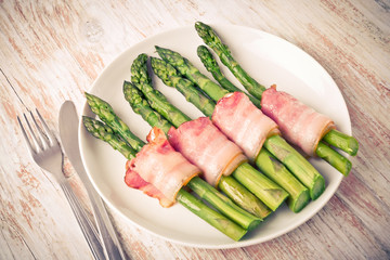 Green asparagus wrapped in ham