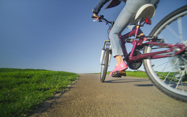 Fototapeta na wymiar Wide angle view of a child riding a bike