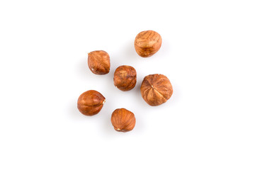 Hazelnuts on the white background