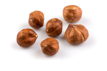 Hazelnuts on the white background