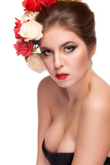 Naklejka premium Sexy woman with flowers in hair over white background