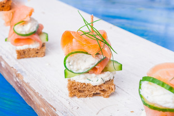 small sandwiches with salmon and cream cheese