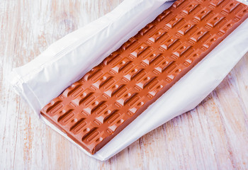 chocolate pieces on white wooden table
