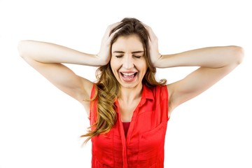 Fototapeta premium Pretty brunette shouting with hands on head