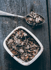 dried oregano on wood background