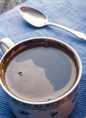 cup of coffee on old wood table