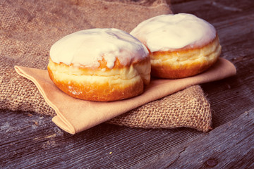 Fresh donuts on wood table