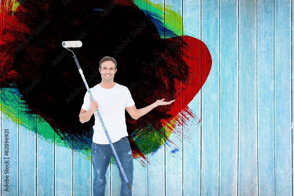Poster composite image of man gesturing while holding paint roller