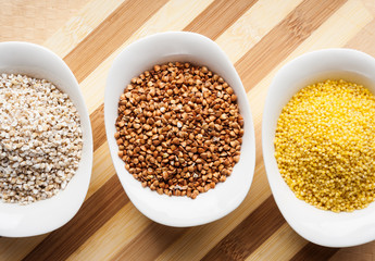 Three kinds of groats: buckwheat, millet and barley groats
