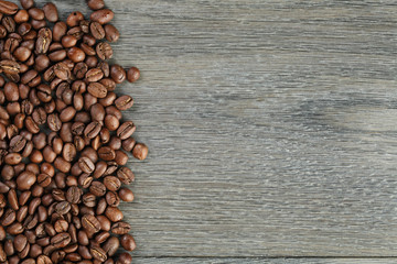 freshly roasted coffee beans on wooden table