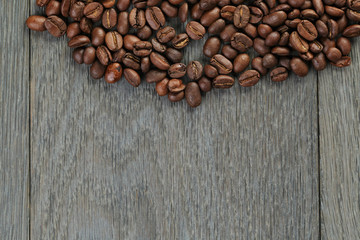 freshly roasted coffee beans on wooden table