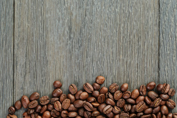 freshly roasted coffee beans on wooden table