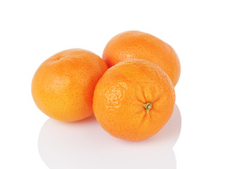 three ripe tangerines isolated on white