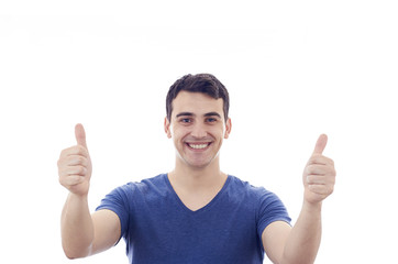 Smiling excited young man with thumb