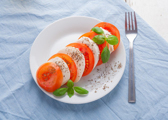 Traditional mozzarella with tomato. Mediterranean salad