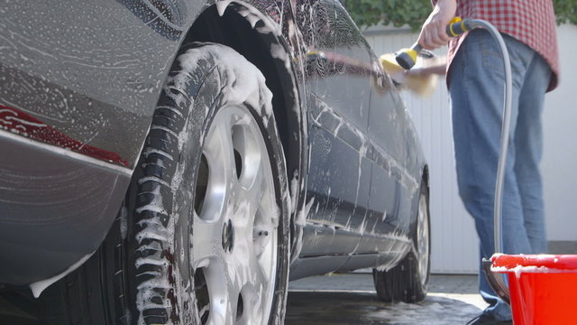 Car Care - Washing a car by hand - sliding camera