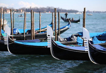 three gondolas in Venice in Italy