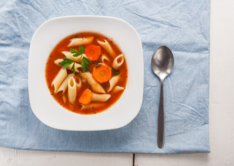 Tomato soup with pasta.